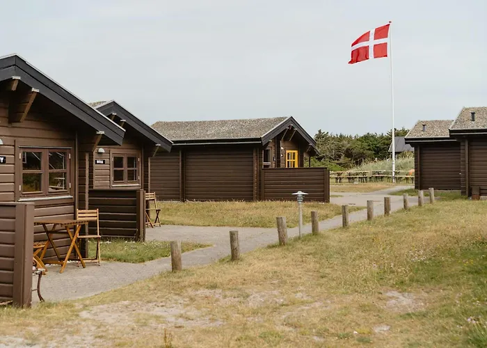 A Small Wooden Hut In A Large Community Ulfborg