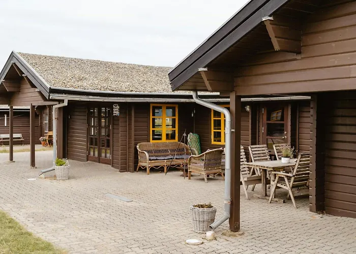 A Small Wooden Hut In A Large Community